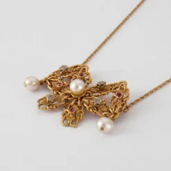 Collier nœud en Or jaune, perles & diamants