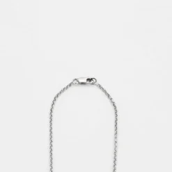 Collier or gris, diamants et tanzanite