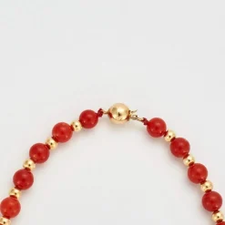 Collier or jaune billes de corail