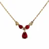 Collier or jaune, diamants et rubis poires