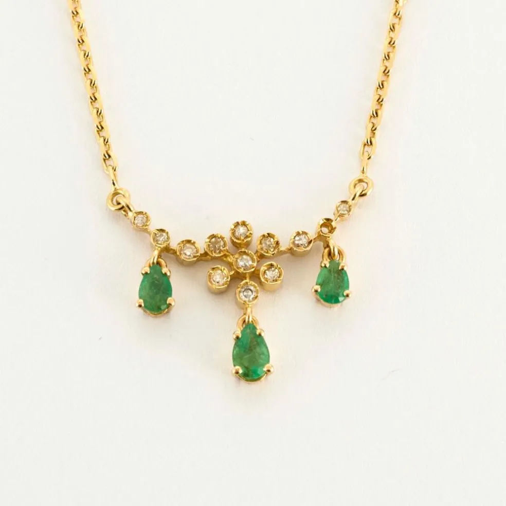 Collier or jaune diamants émeraudes