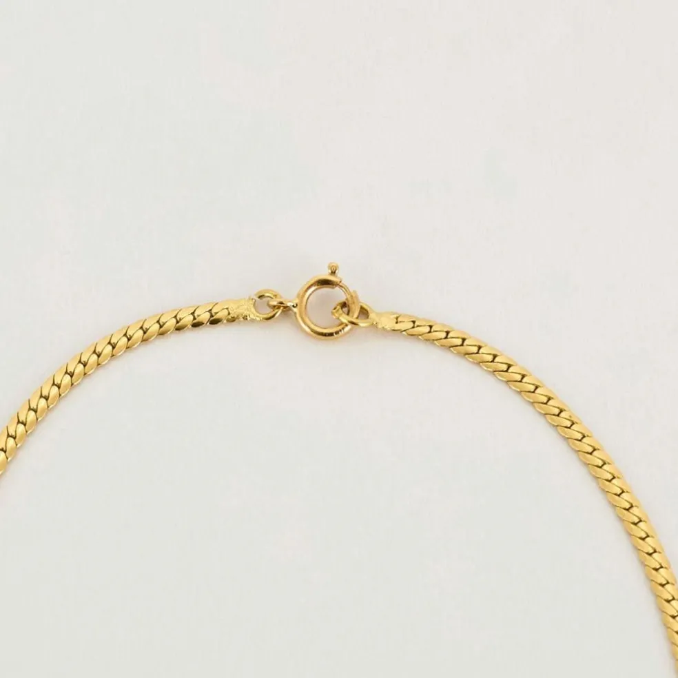 Collier or jaune maille cobra saphir