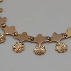 Collier or jaune motif fleur
