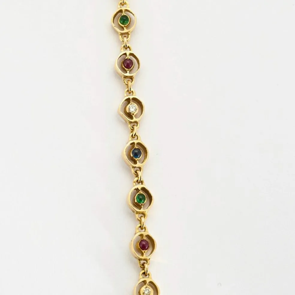 Collier or jaune, saphir, émeraudes et rubis