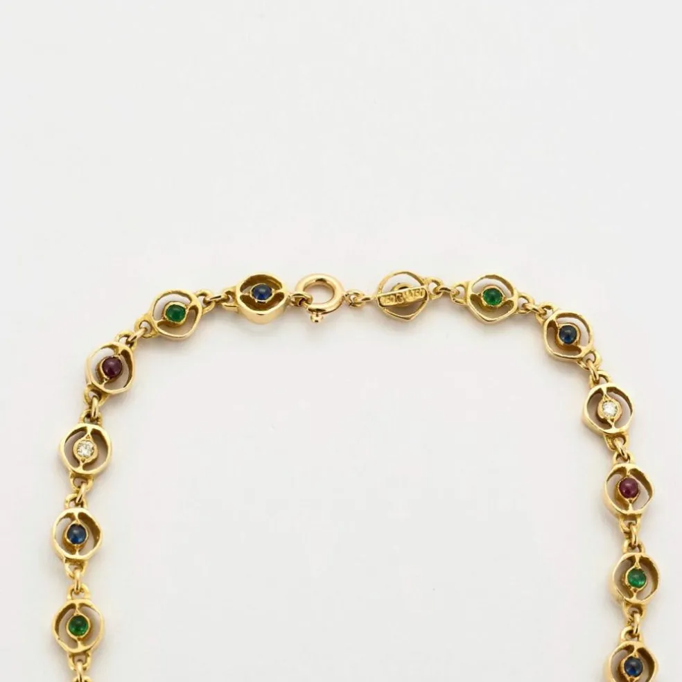 Collier or jaune, saphir, émeraudes et rubis