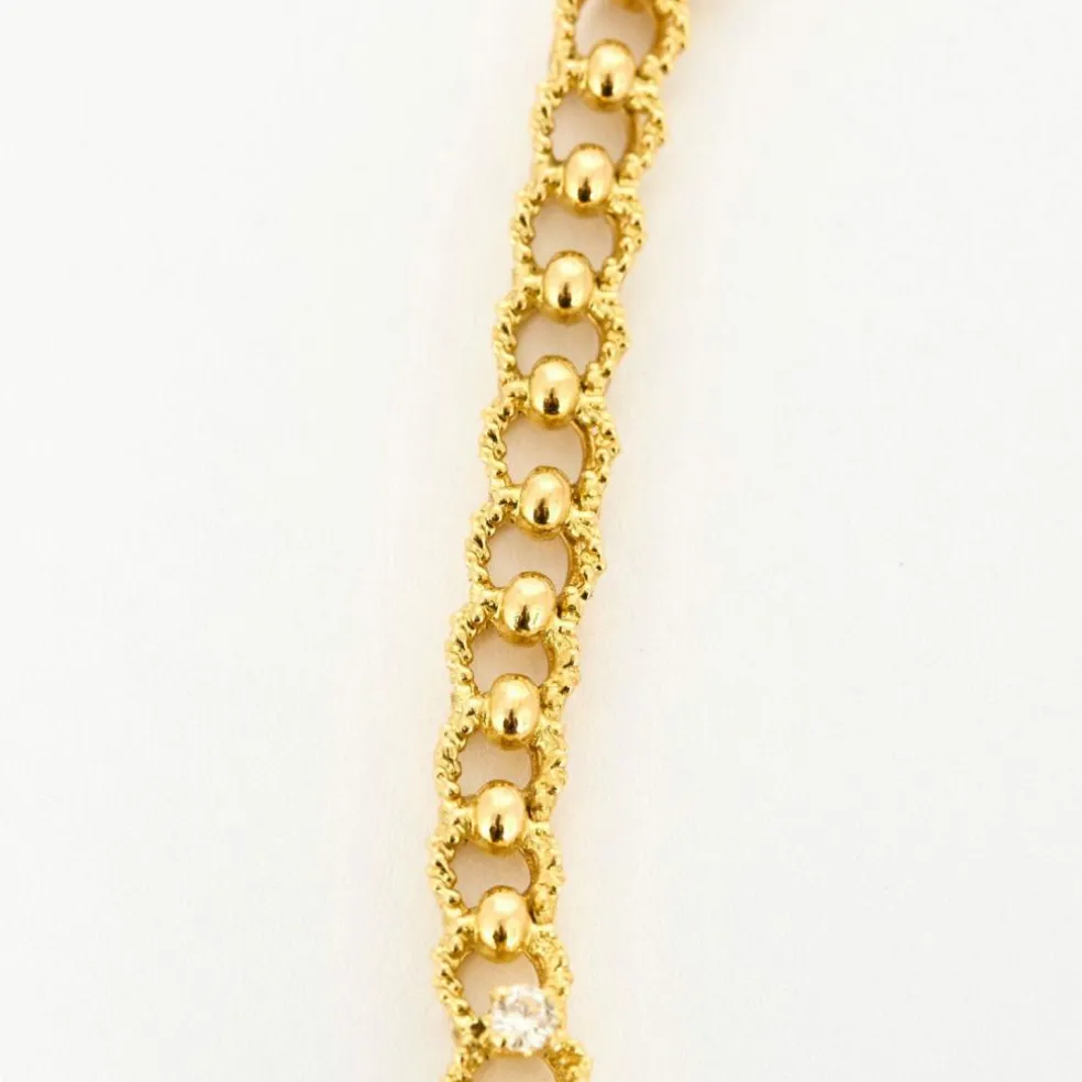 Collier or jaune texturé et diamants