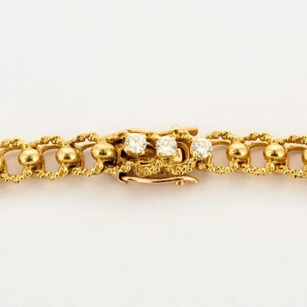 Collier or jaune texturé et diamants