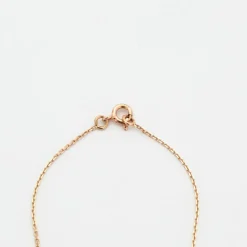 Collier or rose serti d’un saphir