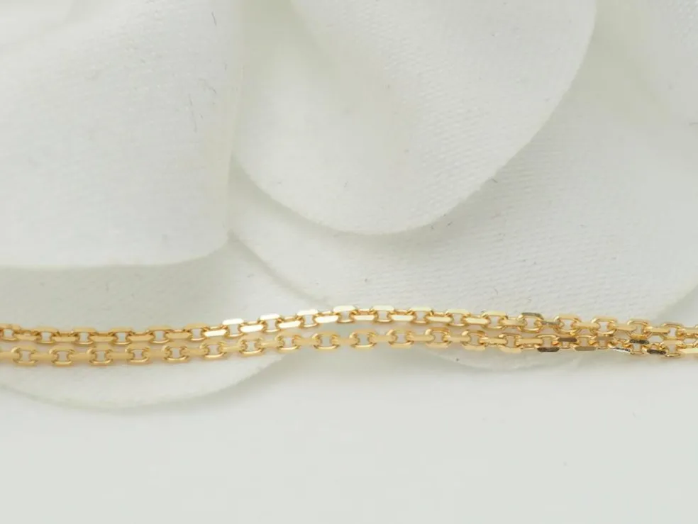 Collier pendentif croix en or jaune et grenats