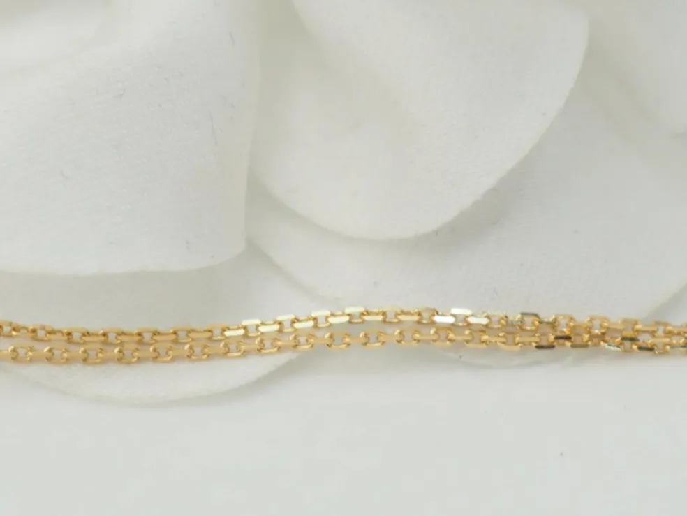 Collier pendentif en or jaune et grenats