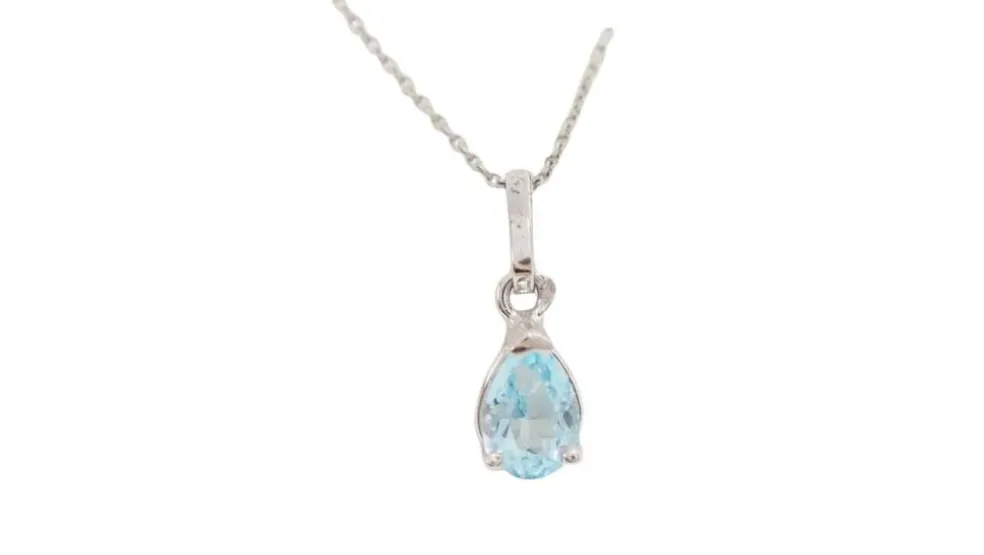 Collier solitaire or blanc et topaze bleue