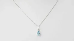 Collier solitaire or blanc et topaze bleue