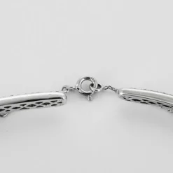 Collier torque or gris et diamants