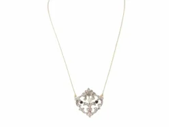 Collier volutes en or jaune et argent, grenat diamants et perle