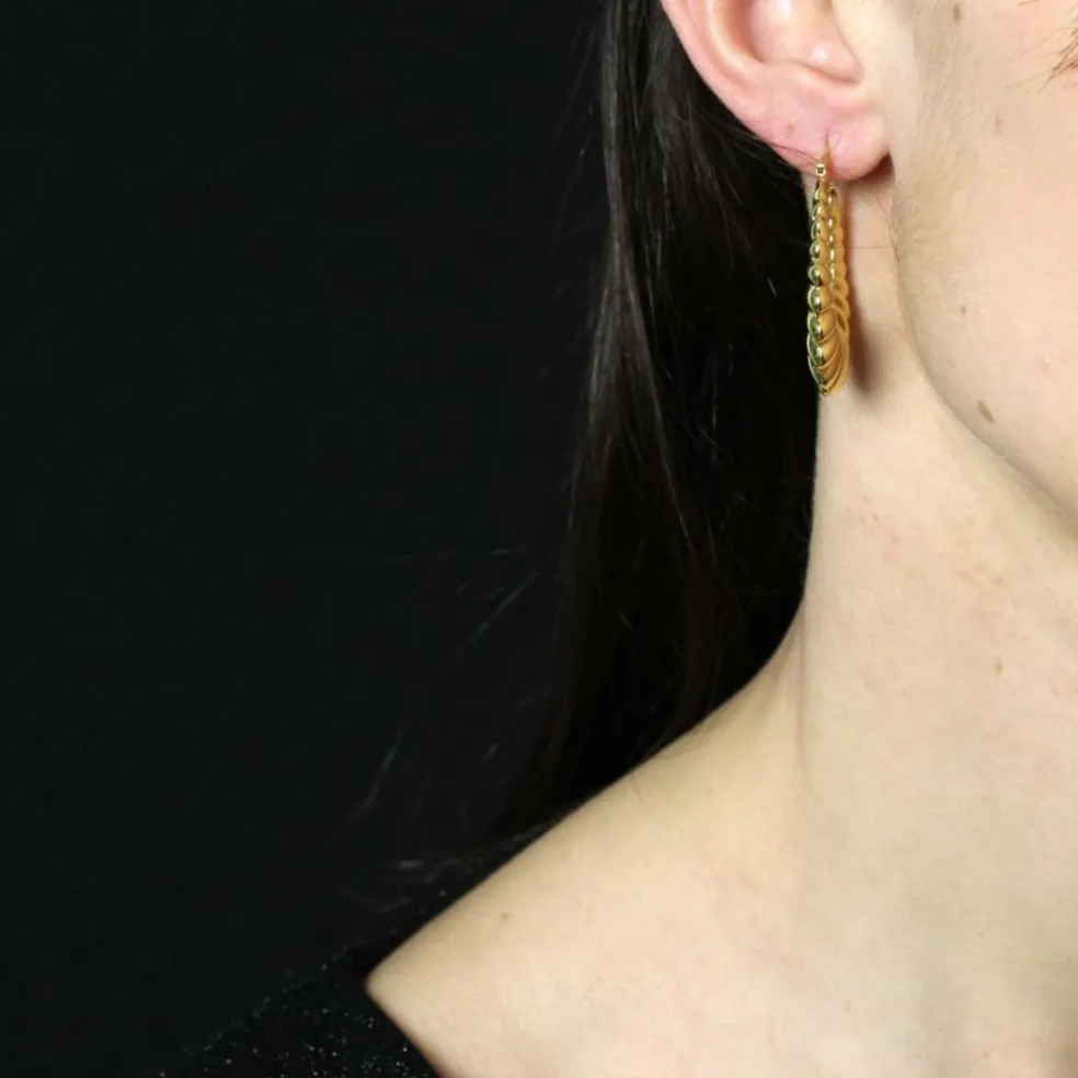Grandes boucles d'oreilles créoles en or jaune godronné