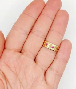 Large bague jonc Art Déco or rose, rubis sertis étoilés (circa 1950)