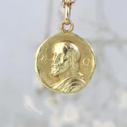 Médaille de baptême or jaune Christ Catacombes signée Becker