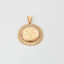 Médaille motif floral décor rayonnant