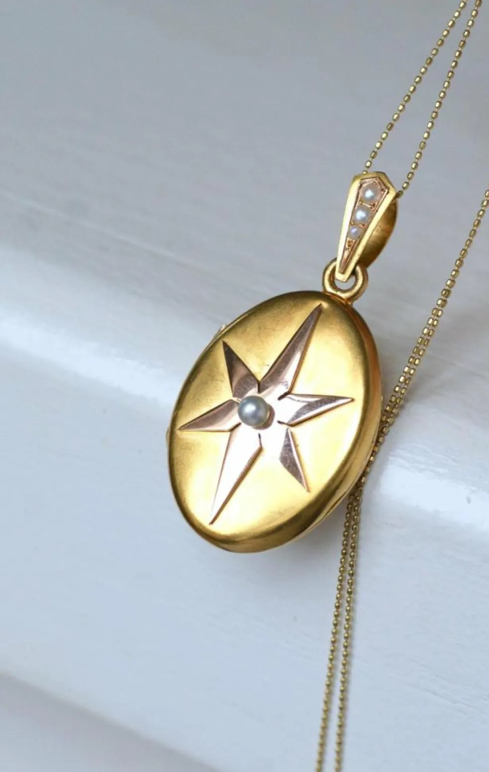Médaillon ancien étoile or rose et or jaune, perles fines