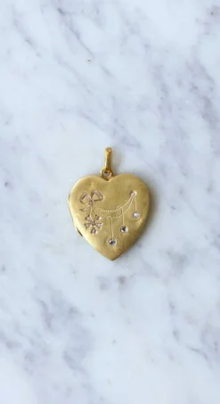 Médaillon cœur ouvrant en or, diamants, et perles