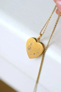 Médaillon cœur ouvrant en or, diamants, et perles