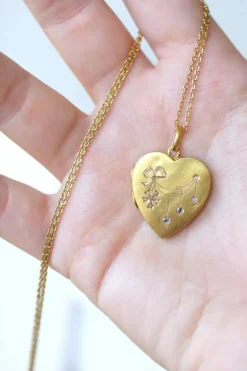 Médaillon cœur ouvrant en or, diamants, et perles