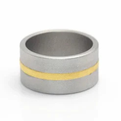 NIESSING - Bague FUSION en Or Jaune et Acier. Tout neuf