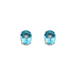 Paire de boutons d'oreilles en or blanc ornées de 2 topazes et 2 diamants