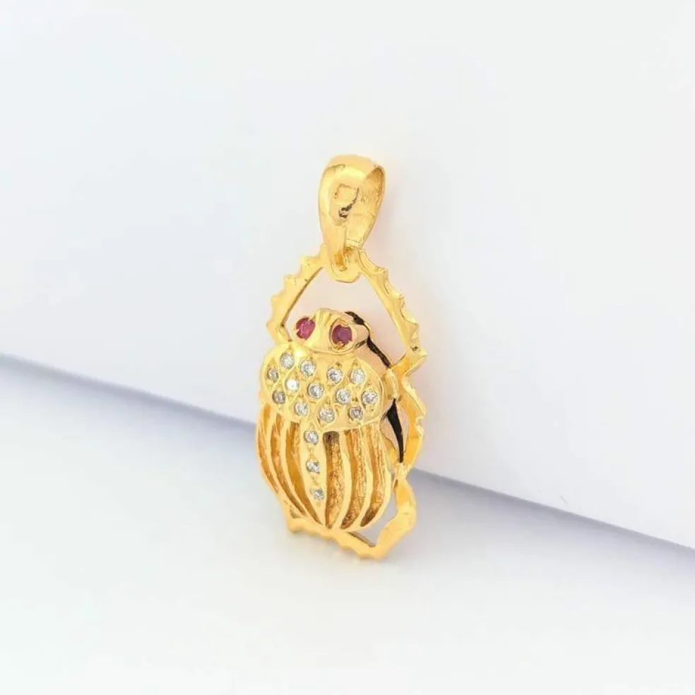 Pendentif animalier en or jaune diamants et rubis