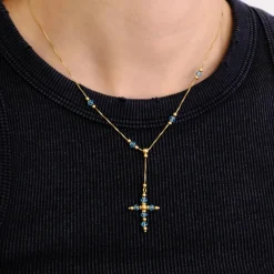 Pendentif croix topaze sur chaîne or jaune