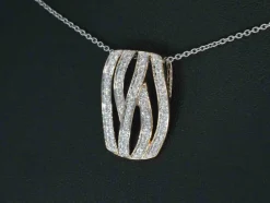 Pendentif design en or rose avec diamants taille brillant