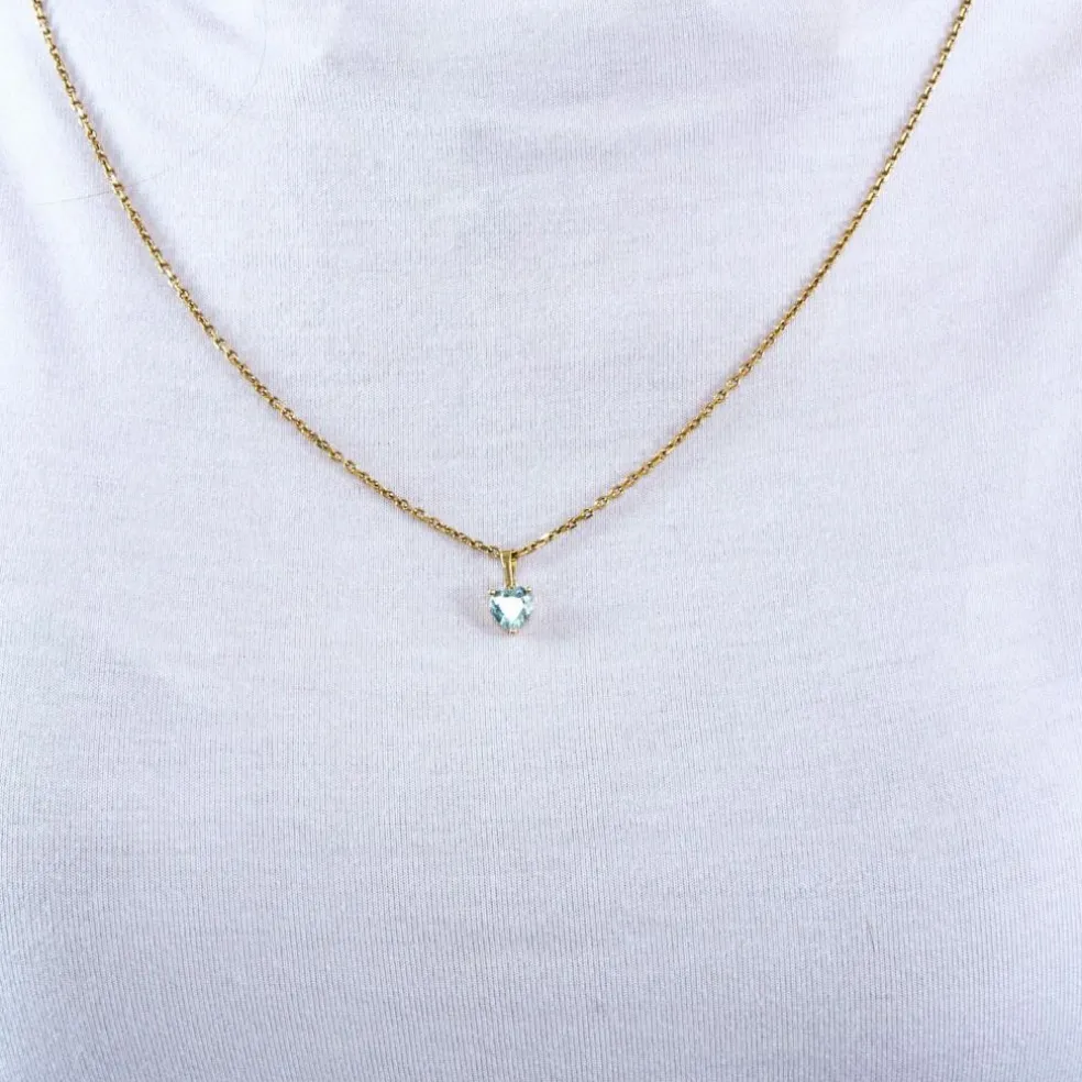 Pendentif or jaune et topaze bleue