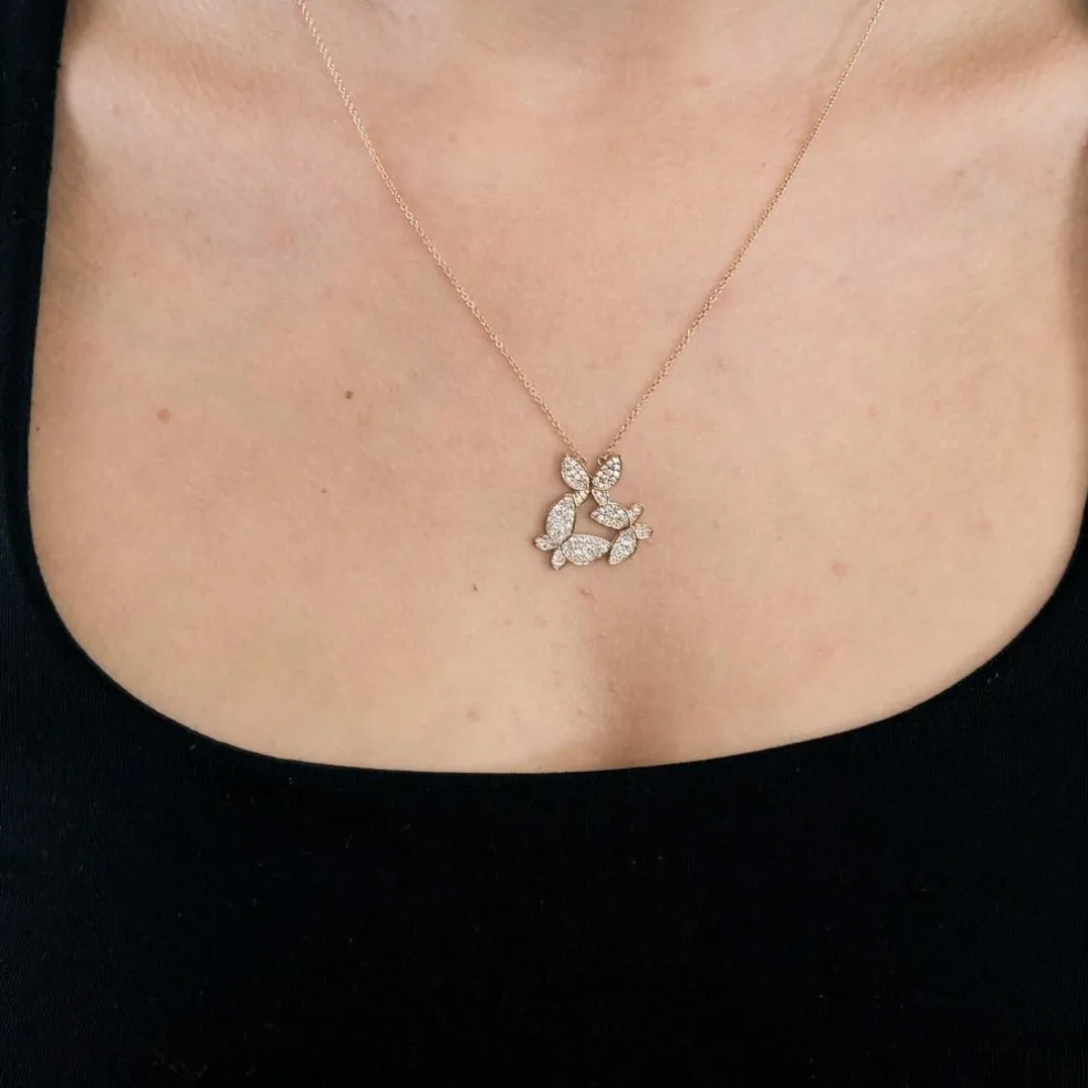 Pendentif or rose, motif papillon